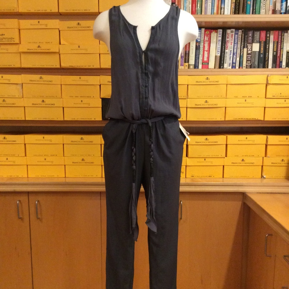 NWT free people jumpsuit. Size XS. In storm grey.